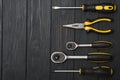 Set of assorted work carpentry and locksmith tools on a dark wooden background with copy space Royalty Free Stock Photo