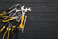 Set of assorted work carpentry and locksmith tools on a dark wooden background with copy space Royalty Free Stock Photo