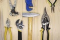 A set of assorted work carpentry and locksmith tools on a light wooden background with copy space Royalty Free Stock Photo