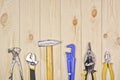 A set of assorted work carpentry and locksmith tools on a light wooden background with copy space Royalty Free Stock Photo