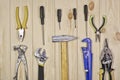 A set of assorted work carpentry and locksmith tools on a light wooden background with copy space Royalty Free Stock Photo