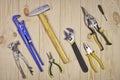 A set of assorted work carpentry and locksmith tools on a light wooden background with copy space Royalty Free Stock Photo