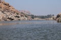 Tungabhadra river in Hampi, Karnataka - tourists enjoying coracle ride in deep river - India tourism Royalty Free Stock Photo