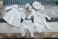 Set of baby clothes, including bodysuits, sliders, sneakers, socks, t-shirt hat Royalty Free Stock Photo