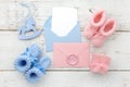 Set of baby girl and boy booties and greeting card form. Top view Royalty Free Stock Photo