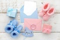 Set of baby girl and boy booties and greeting card form. Top view Royalty Free Stock Photo