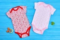 Set of baby-girl cotton bodysuits.