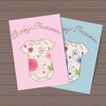 Set of baby showers with body dresses on wooden background