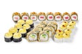 Set of baked sushi rolls with cheese and tempura rolls on white Royalty Free Stock Photo