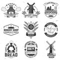 Set of Bakery shop badge. Vector Design with windmill, rolling pin, dough, wheat ears, old oven, wooden bread shovels Royalty Free Stock Photo