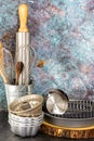 Set of baking utensil store in a metal tin in front of cement wall in front view Royalty Free Stock Photo