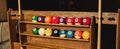 Set of balls for a game of pool billiards on shelves Royalty Free Stock Photo