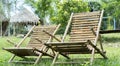 A set of bamboo chairs. Two chairs on a nature background. Country style bamboo bench in garden Royalty Free Stock Photo