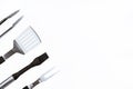 Set with barbecue utensils on white background. Stainless steel spatula, oil brush, tongs, fork for bbq. Copy space Royalty Free Stock Photo