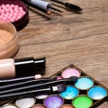 Set of basic make-up products on wooden surface Royalty Free Stock Photo