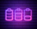 Set of battery neon icon. Charger glowing sign. Vector symbol of low and full battery isolated on brick wall. Royalty Free Stock Photo