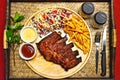 SET of BBQ RIBS Grilled Steak with French Fried and Salad on Bamboo Tray Background