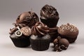 set of beautiful and intricate chocolate cupcakes with elegant swirls, bows, and decorations