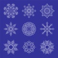 Set of Beautiful Openwork Snowflakes. White Snowflakes on Blue Background. Elements for Christmas and New Year Design