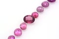 Set of beautiful red and pink polished tourmalines on a neutral background. Precious jewelry and gems
