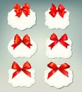 Set of beautiful retro labels with red gift bows w Royalty Free Stock Photo