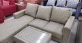 A set of beige sofas made of canvas and a tab