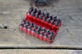 A set of bits for repair. Plastic case with a red background Royalty Free Stock Photo