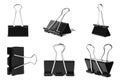Set with black binder clips on white background