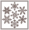 Set of 7 black elegant geometric winter snowflake shapes Royalty Free Stock Photo