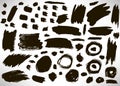 Set of black hand drawn grunge elements, geometrical shapes, dots, rings, circles, banners, brush strokes isolated Royalty Free Stock Photo