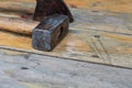 Set of black metal tools logging sledgehammer ax on a wooden background design master tool manual