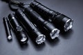 Set of black pocket tactical flashlights isolated