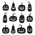 A set of black pumpkin silhouettes with spooky faces. Halloween pumpkins with different facial expressions. Templates Royalty Free Stock Photo