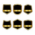 Set of black shields with Golden ribbons in trendy flat style isolated on white background. Herald logo and medieval Shield symbol Royalty Free Stock Photo