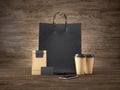 Set of black shopping bag, craft package, two brown coffee cups, blank business cards and generic design smartphone