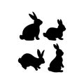 Set of black silhouettes of Easter bunnies.