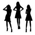 Set of black silhouettes of fashion girls in mini dress posing. Vector illustration