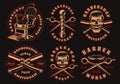 Set of black and white barber emblems on a dark background.
