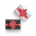 Set of Black and white gift boxes with realistic red ribbon, Top view. Birthday or anniversary present, Holiday decoration element Royalty Free Stock Photo