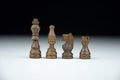 Set of black wooden chess figures on a blurred black and white background Royalty Free Stock Photo
