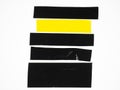 Black yellow tape texture Torn horizontal and different size sticky tape, adhesive pieces. sticky tape cut isolated on white Royalty Free Stock Photo