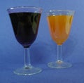 Cups of colorful cocktails mimosa and red wine set un on a blue background Royalty Free Stock Photo