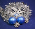 Set blue beautiful glass New Year`s balls, brilliant tinsel, on a blue background - New Year`s composition, a card Royalty Free Stock Photo