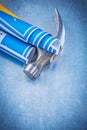 Set of blue construction plans claw hammer on metallic backgroun Royalty Free Stock Photo
