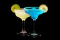 Set of Blue Curacao cocktails garnished with a lime isolated on black background Royalty Free Stock Photo