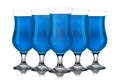 Set of blue curacao cocktails in hurricane glass isolated on white background Royalty Free Stock Photo