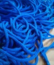 A set of blue kur rope insulated on a wooden board