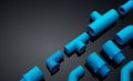 Set of blue PVC pipe fittings isolated on dark background. Blue plastic water pipe. PVC accessories for plumbing. Plumber Royalty Free Stock Photo