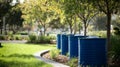 Set of Blue Rainwater Tanks Installed at Public Green Space Royalty Free Stock Photo