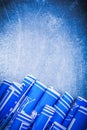 Set of blue rolled construction drawings on metallic background Royalty Free Stock Photo